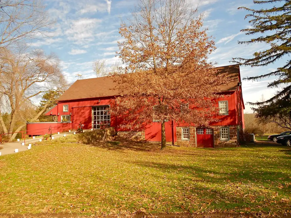 Red barn and lawn in Hilltown Township, Bucks County, PA, where many homes rely on septic systems