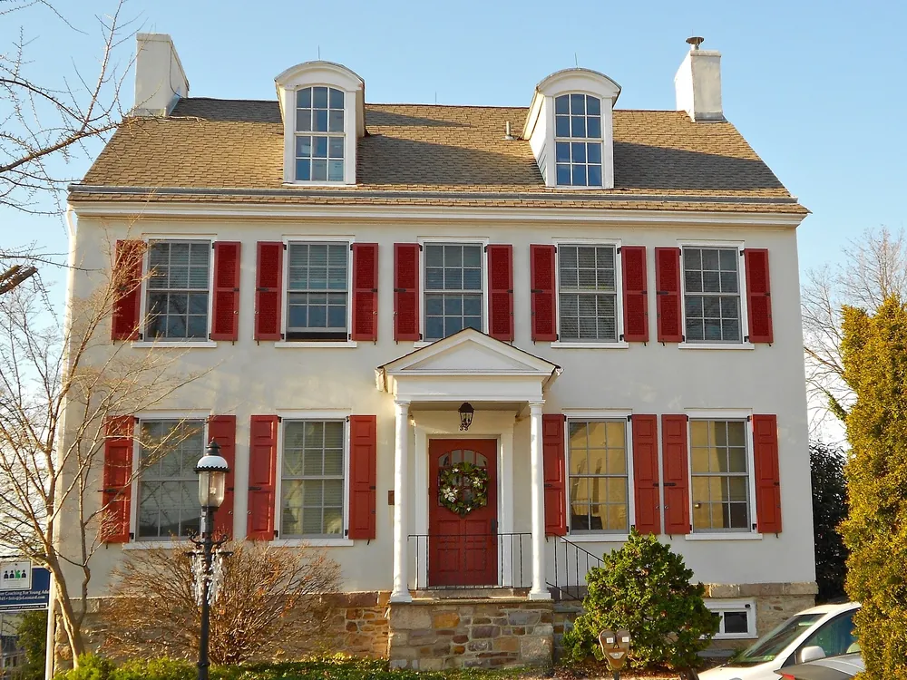 White house with red shutters in Bucks County, Pennsylvania